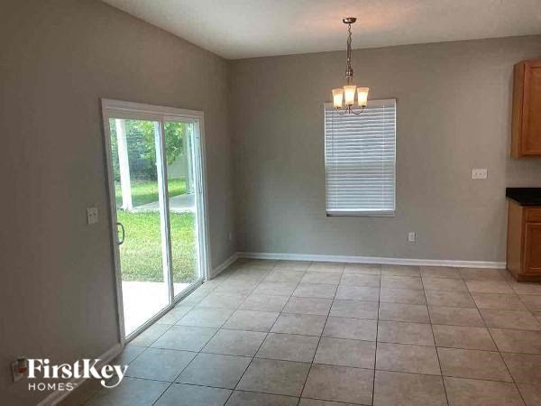 a empty living room with a sliding glass door