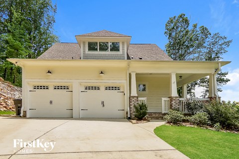 a house with a driveway and a garage door