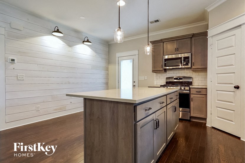 a kitchen with a large counter top and a sink
