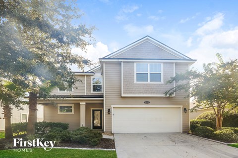 A house with a garage is for sale by FirstKey Homes.