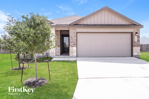 a house with a driveway and a garage door