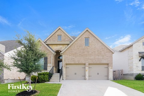 a brick house with a white garage door