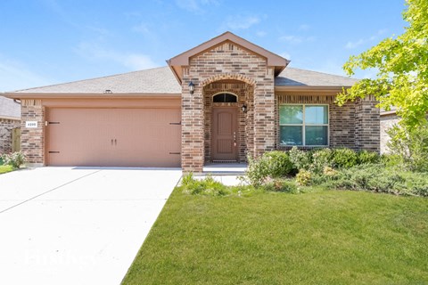 a house with a driveway and a garage door