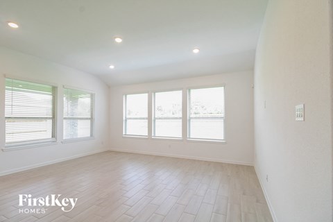 A spacious room with a FirstKey HOMES logo on the bottom left.