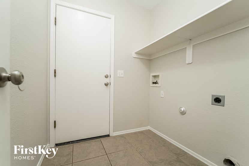 a bathroom with a closet and a door to a hallway