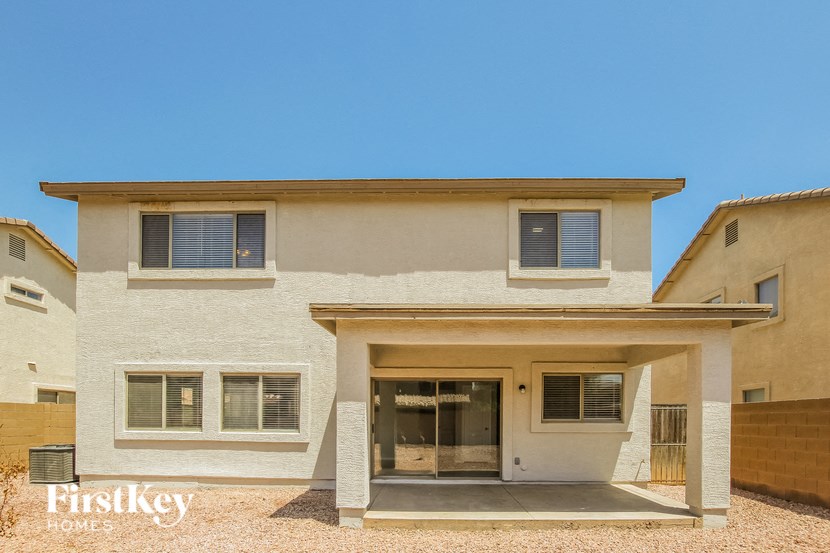 A modern house with a flat roof and a garage.