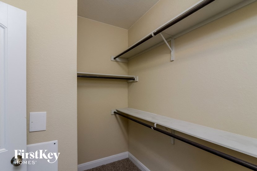 a empty closet with a counter and a shelf