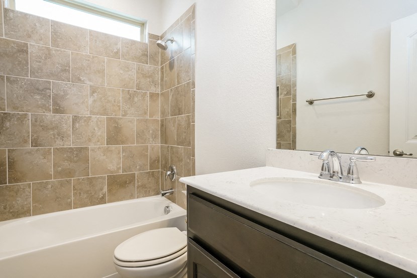 the preserve at ballantyne commons apartment bathroom with tub sink and toilet