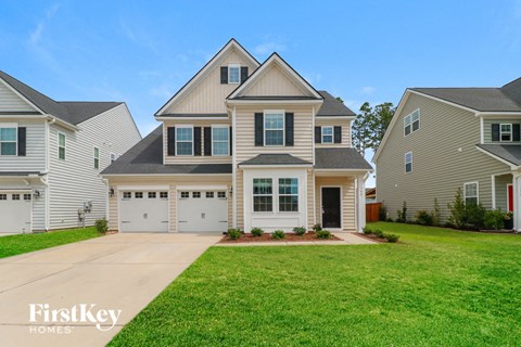 A house with a garage is for sale by FirstKey Homes.
