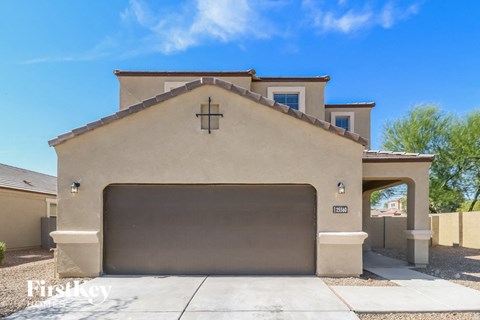 a house with a garage door in front of it