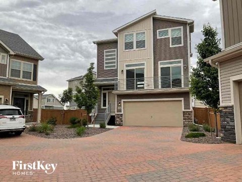 a house with a driveway and a car garage