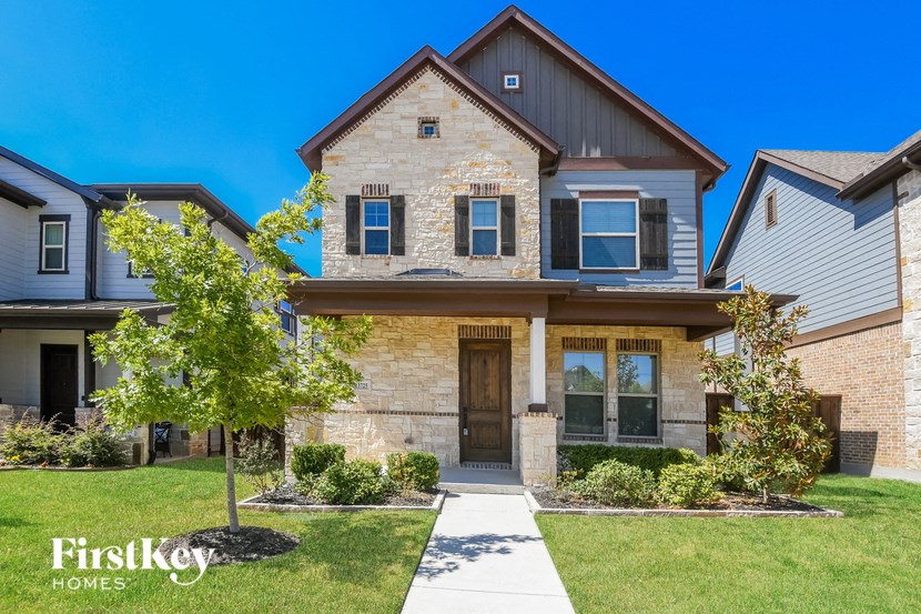 a house with a sidewalk in front of it