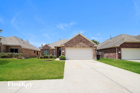 a brick house with a white garage door