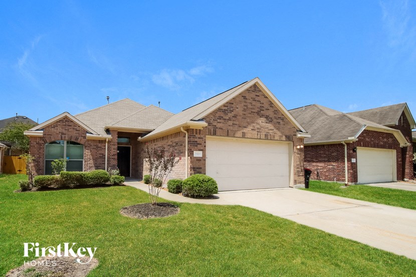 a brick house with a white garage door