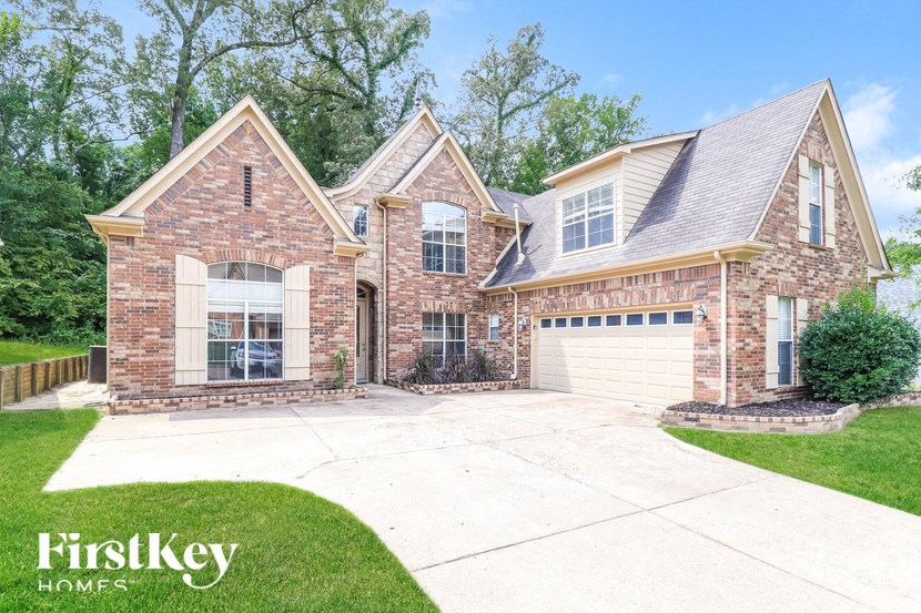 A brick house with a garage is for sale by FirstKey Homes.