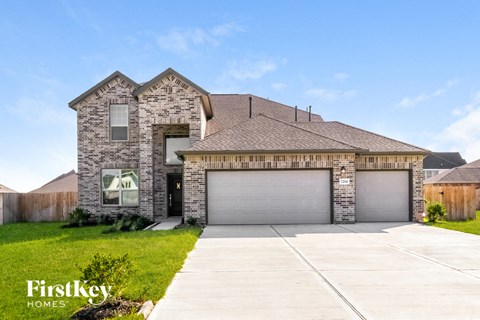 a large house with a garage door in front of it