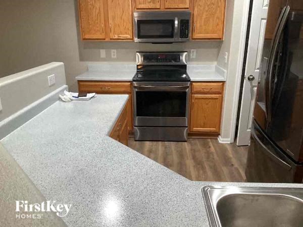 a kitchen with a stove and a sink