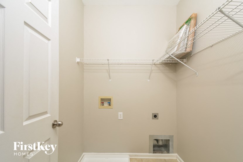 a closet with a wire closet organizer and a white door