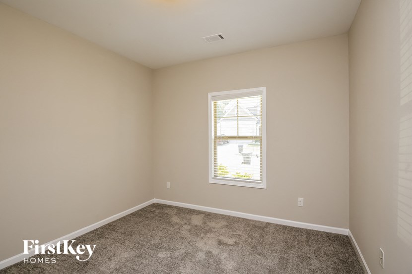 a room with carpet and a window in it