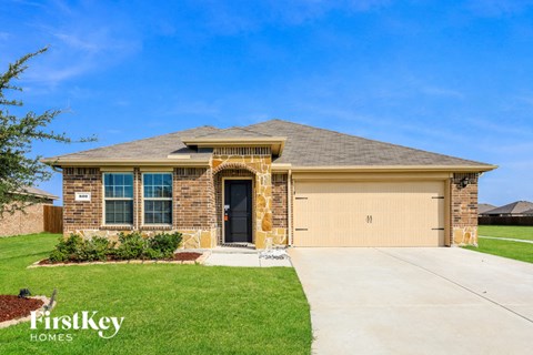 a house with a driveway and a garage door
