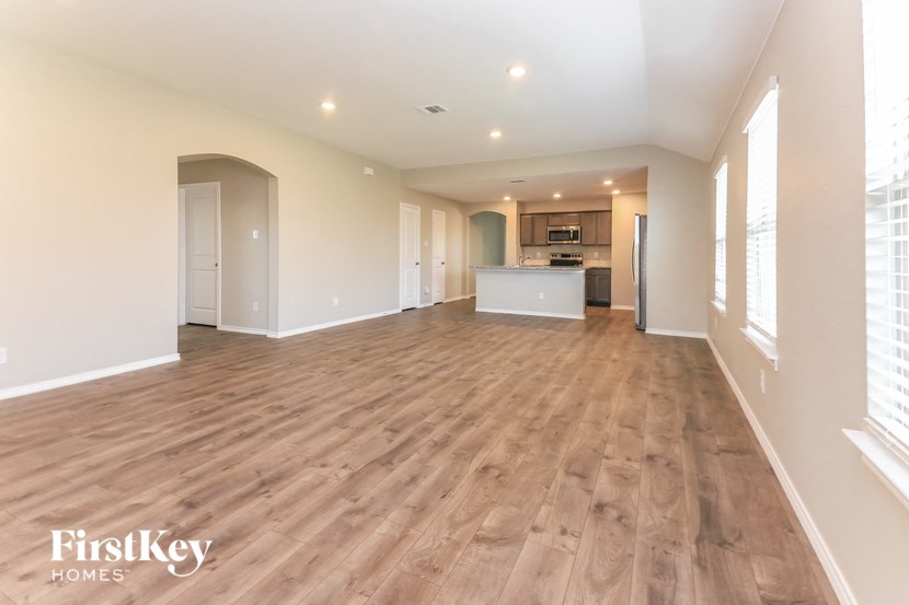 the living room and kitchen are spacious and ready for guests to use