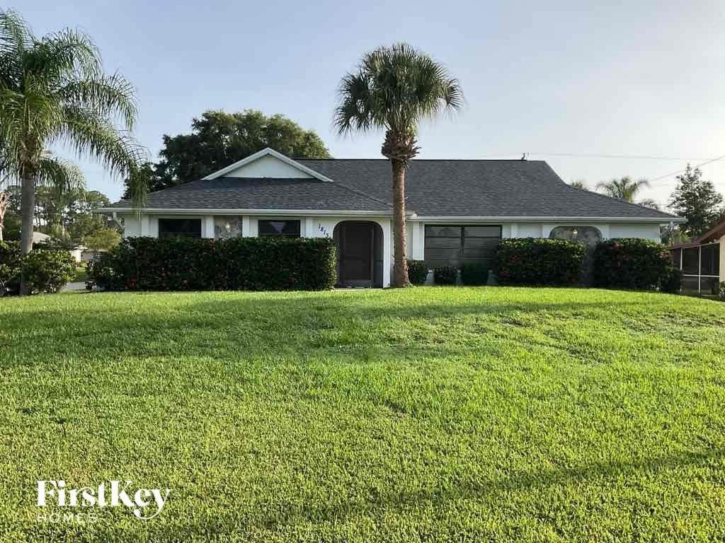 A house with a lawn in front of it.