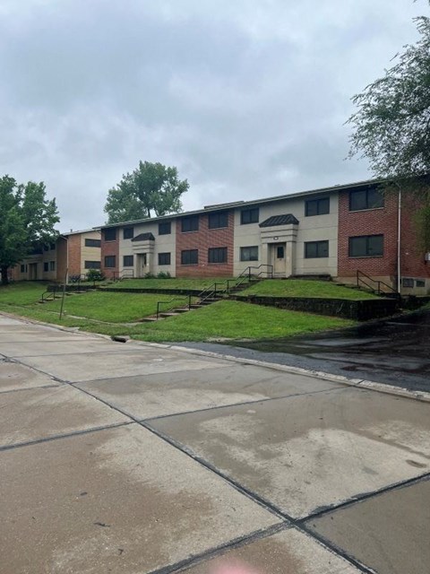 an apartment building on the side of a street