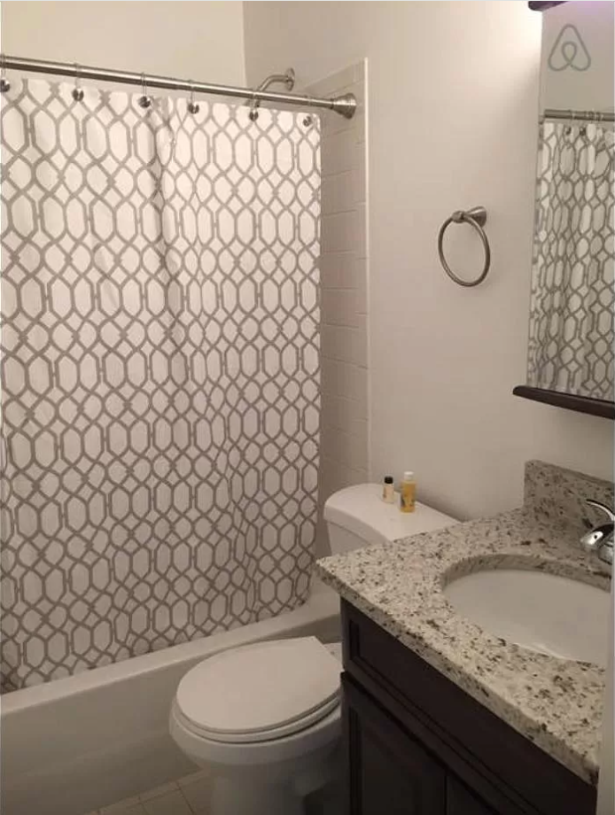 a bathroom with a sink and a toilet and a shower