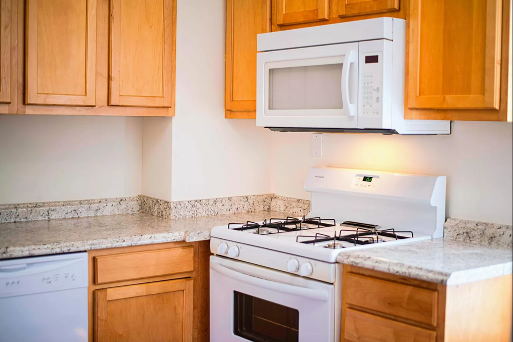 a kitchen with a stove and a microwave