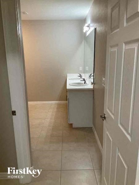 a small bathroom with a sink and a mirror