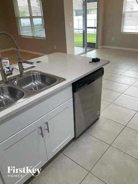 a kitchen with a sink and a dishwasher