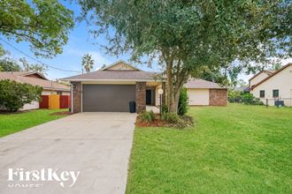 a home with a driveway and a garage door