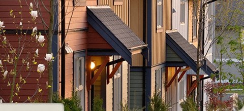 A house with a brown roof and a white door.