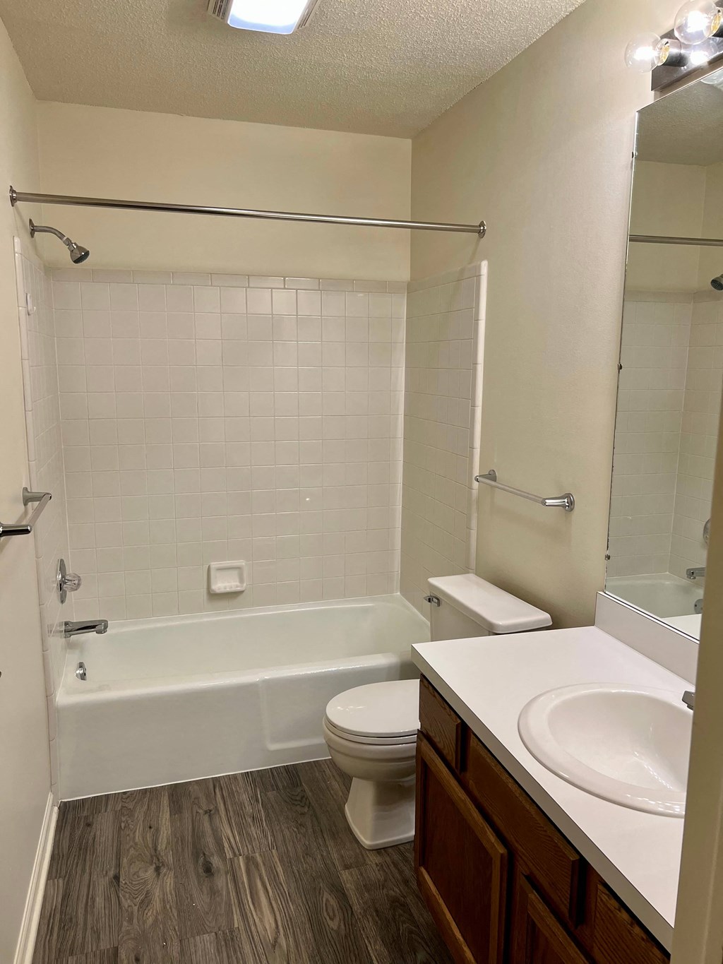 a bathroom with a shower toilet and sink