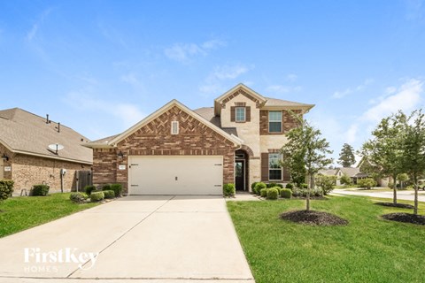a large brick house with a white garage door
