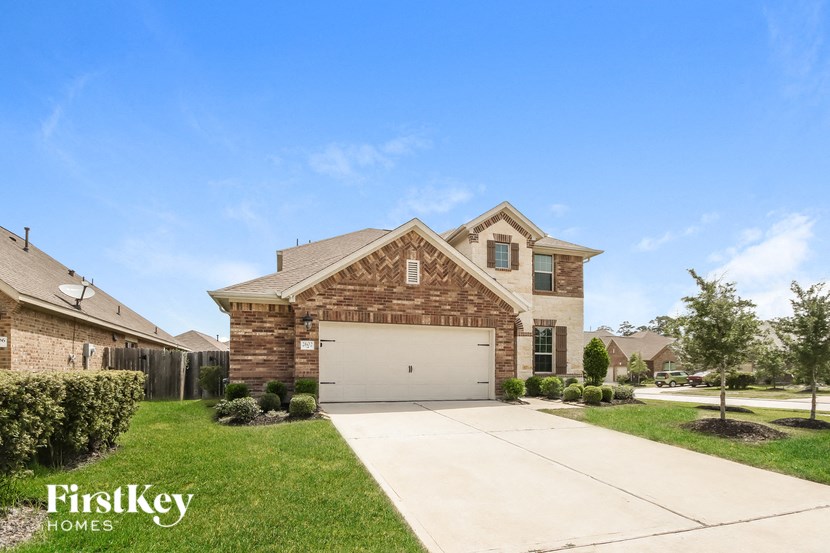 a brick house with a white garage door