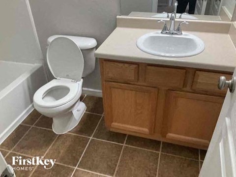 a bathroom with a toilet and a sink
