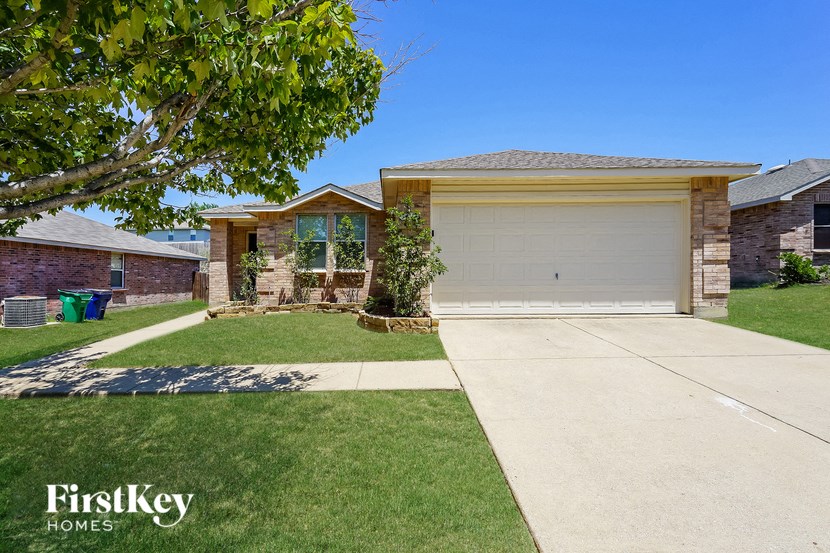 a house with a driveway and a garage door