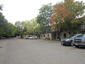 a parking lot with cars parked in front of a building