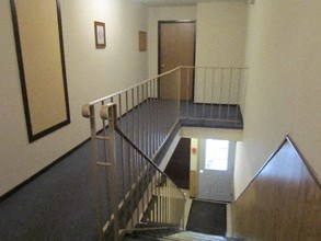 the stairs in a building with a door