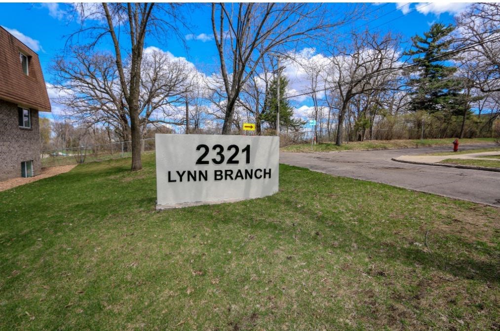 a yard sign that reads 2211 lyin branch in the grass