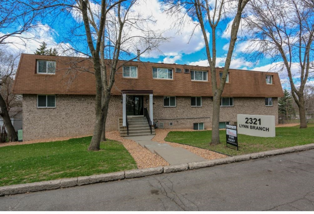 an image of a house with a sign in front of it
