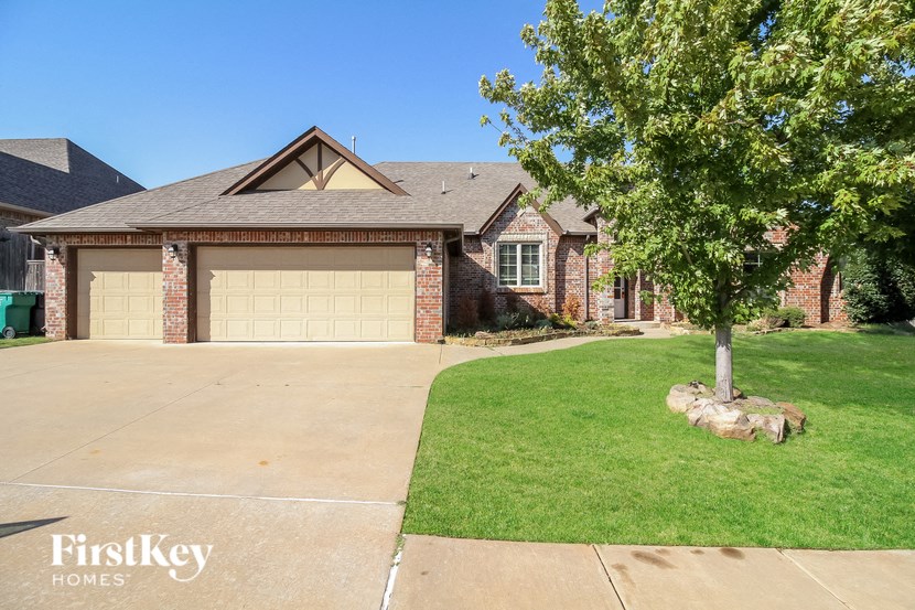 a large house with a driveway and a garage door