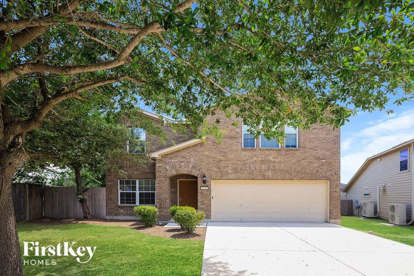 A house with a tree in front of it.