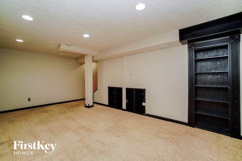 a empty room with a closet and a door