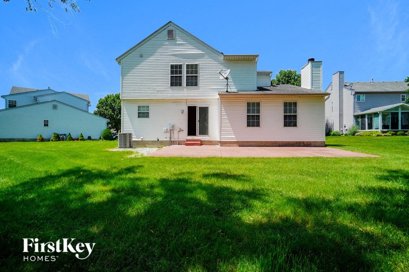 a white house with a lawn in front of it