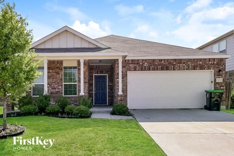 a house with a driveway and a garage door