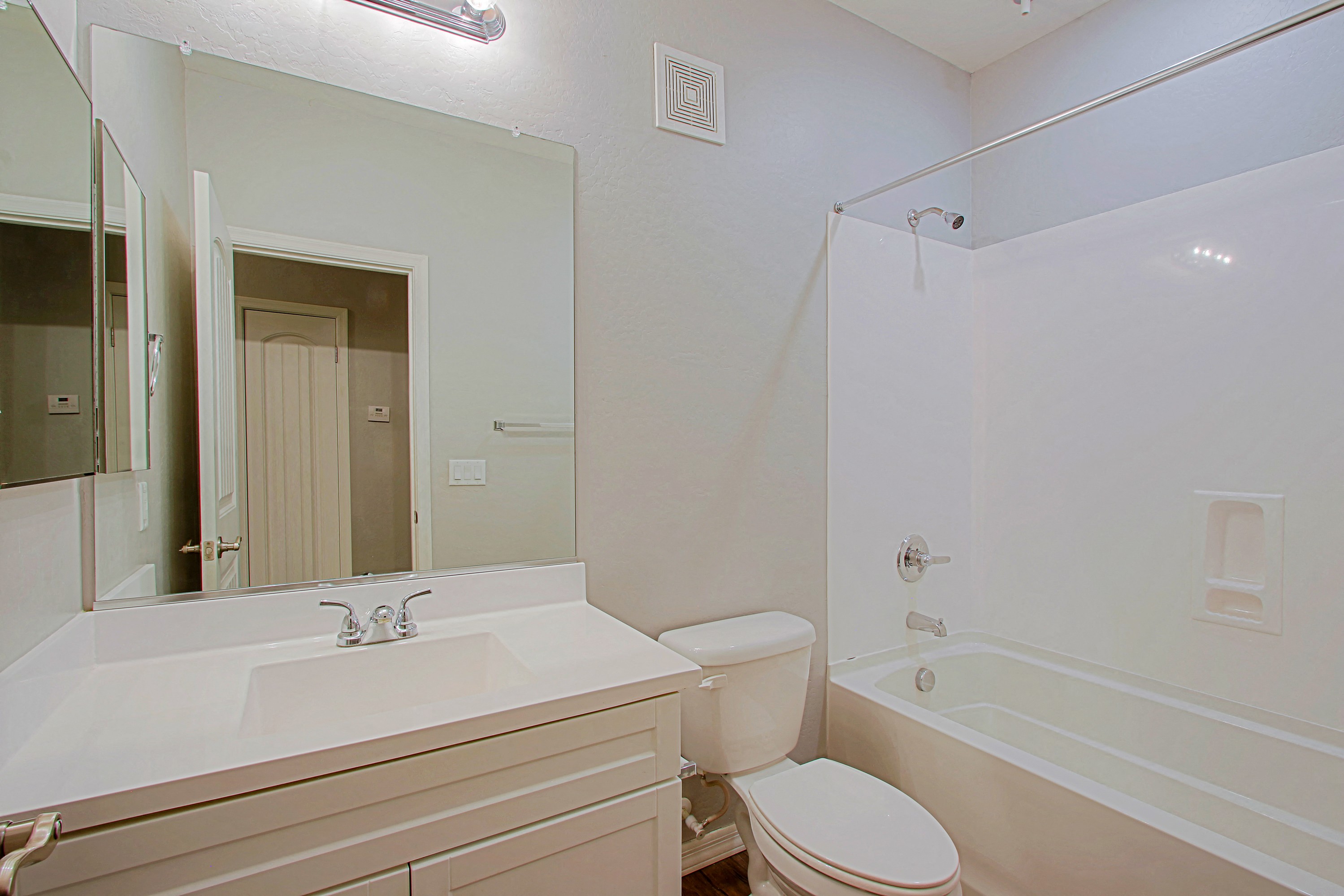 a bathroom with a sink toilet and a tub