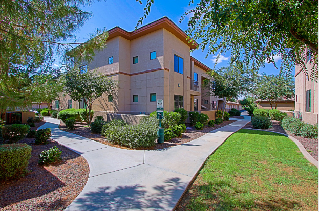 a sidewalk in front of a building