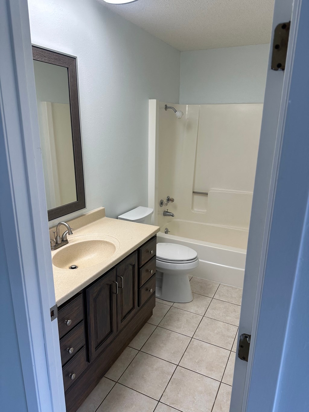 a bathroom with a sink and a toilet and a shower